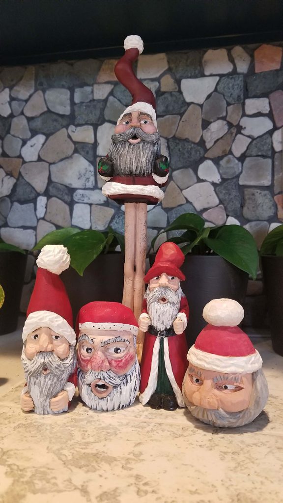 Painted wood carvings of Santas
