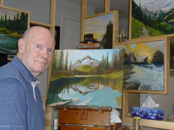 Man in front of easel with painting